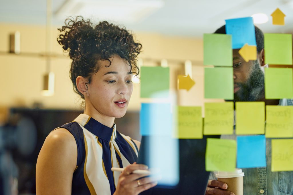 woman looking at a concept wall to check loyalty suitability.