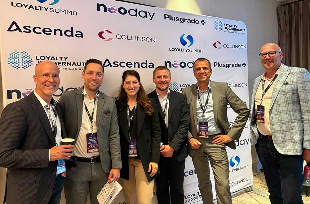 A friendly group of loyalty experts attending a conference together.